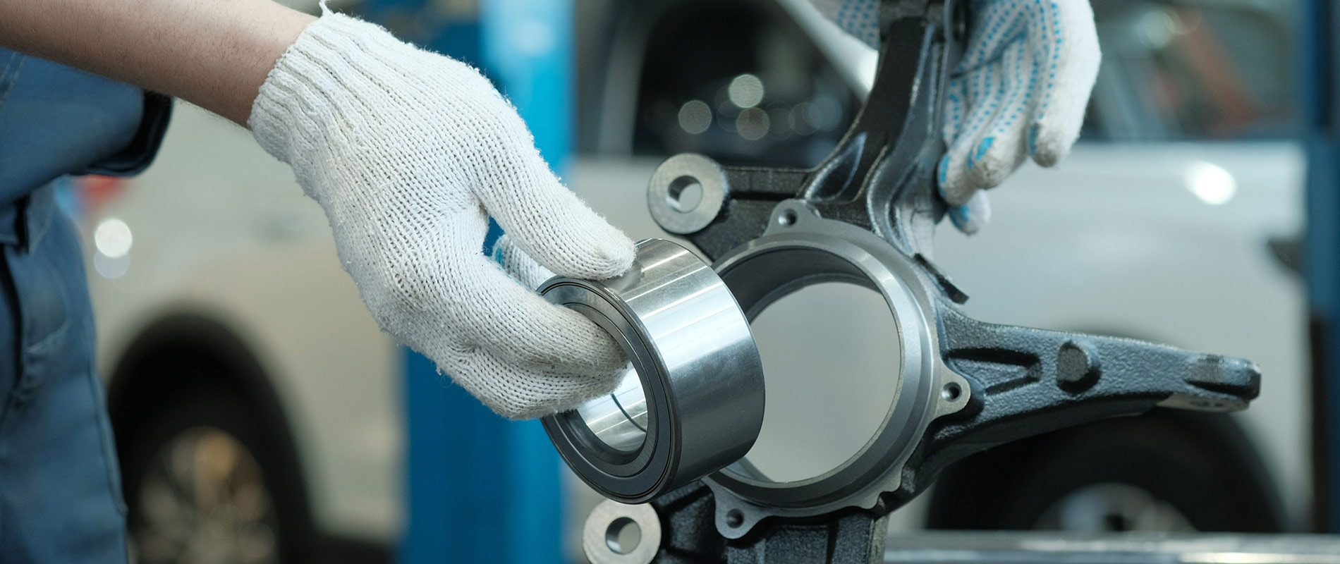 A technician repairing a vehicle component.